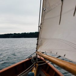 View from the front of a wooden boat towards the ocean